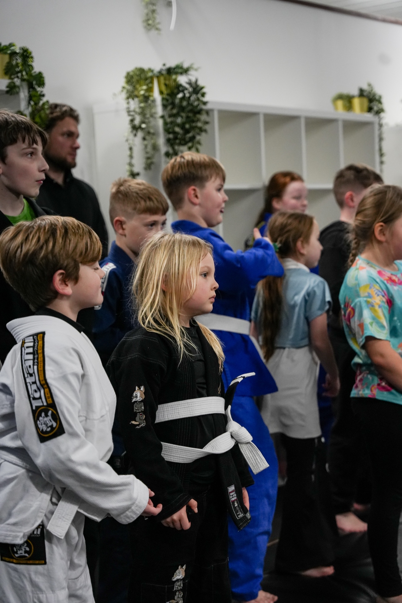 Family martial arts Wigan — kids lined up at Black Dog BJJ